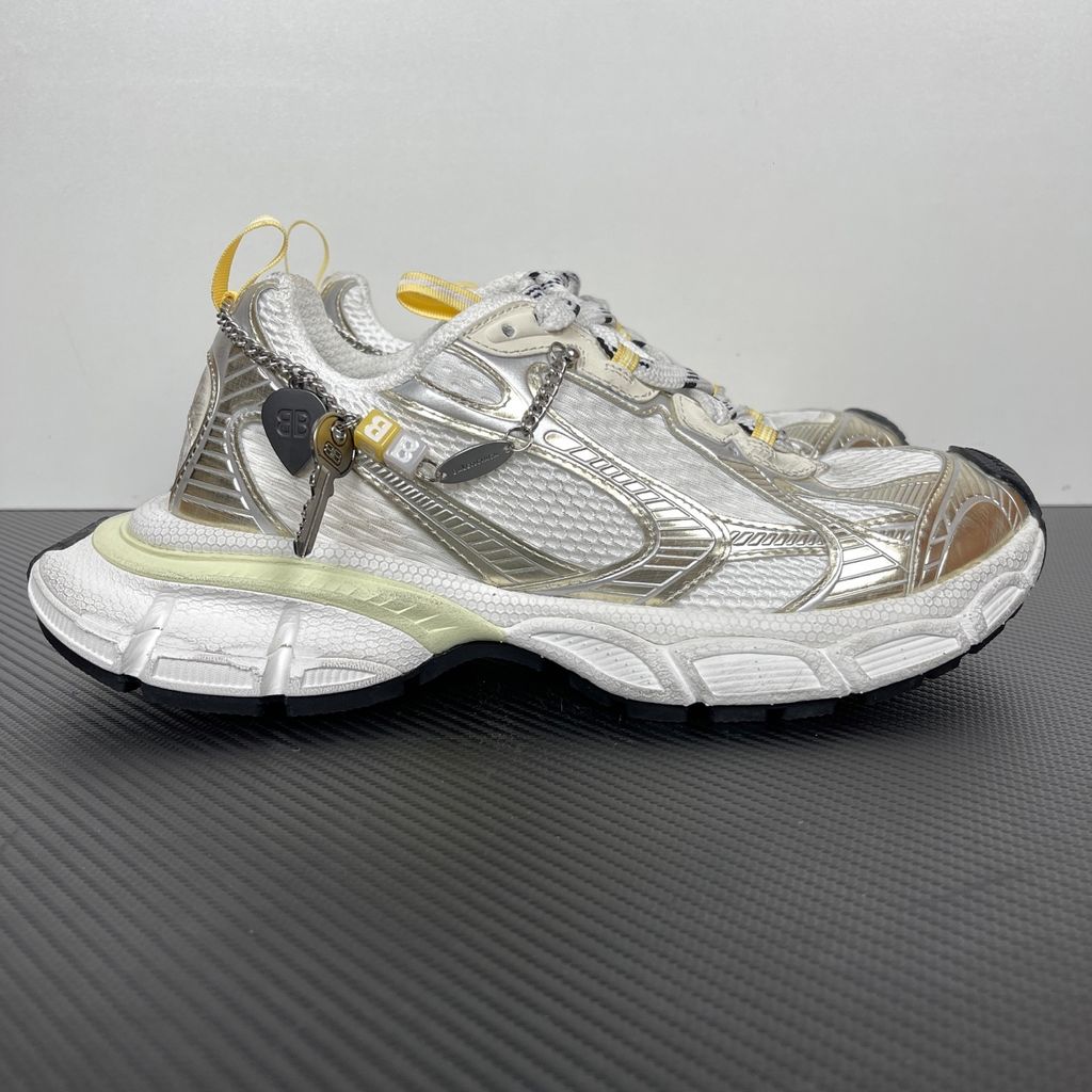 Side profile of the Nike Air Max 270 Premium sneaker in a subtle 'Football Grey' and 'Work Blue' colorway, highlighting the updated breathable premium upper, tonal overlays, and the massive, signature translucent 270-degree Max Air heel unit.