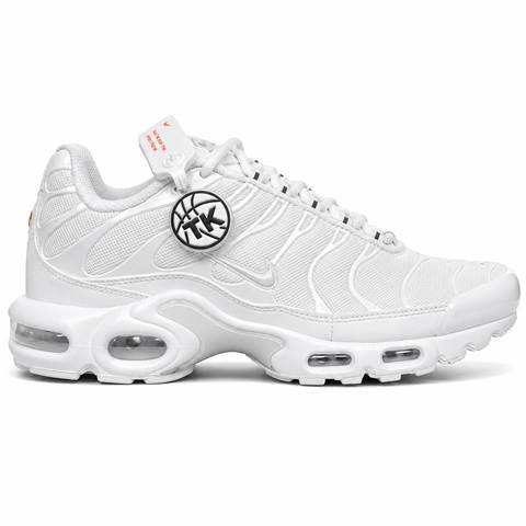 Side profile of the Nike Air Max Plus sneaker in the 'White Pure Platinum' colorway, highlighting the iconic wavy TPU overlays, clean breathable white mesh upper, and the visible Tuned Air cushioning units in the midsole.
