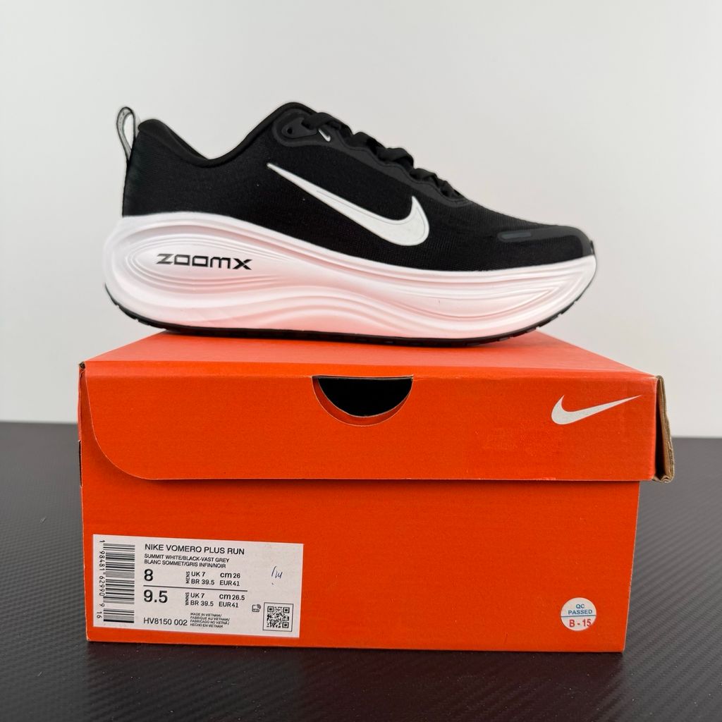 Side profile of the Nike Vomero Plus sneaker in the 'White' colorway, showcasing the clean, monochromatic mesh upper, tonal synthetic overlays, and the sculpted, high-performance foam midsole.
