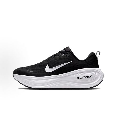 Side profile of the Nike Vomero Plus sneaker in the 'White' colorway, showcasing the clean, monochromatic mesh upper, tonal synthetic overlays, and the sculpted, high-performance foam midsole.