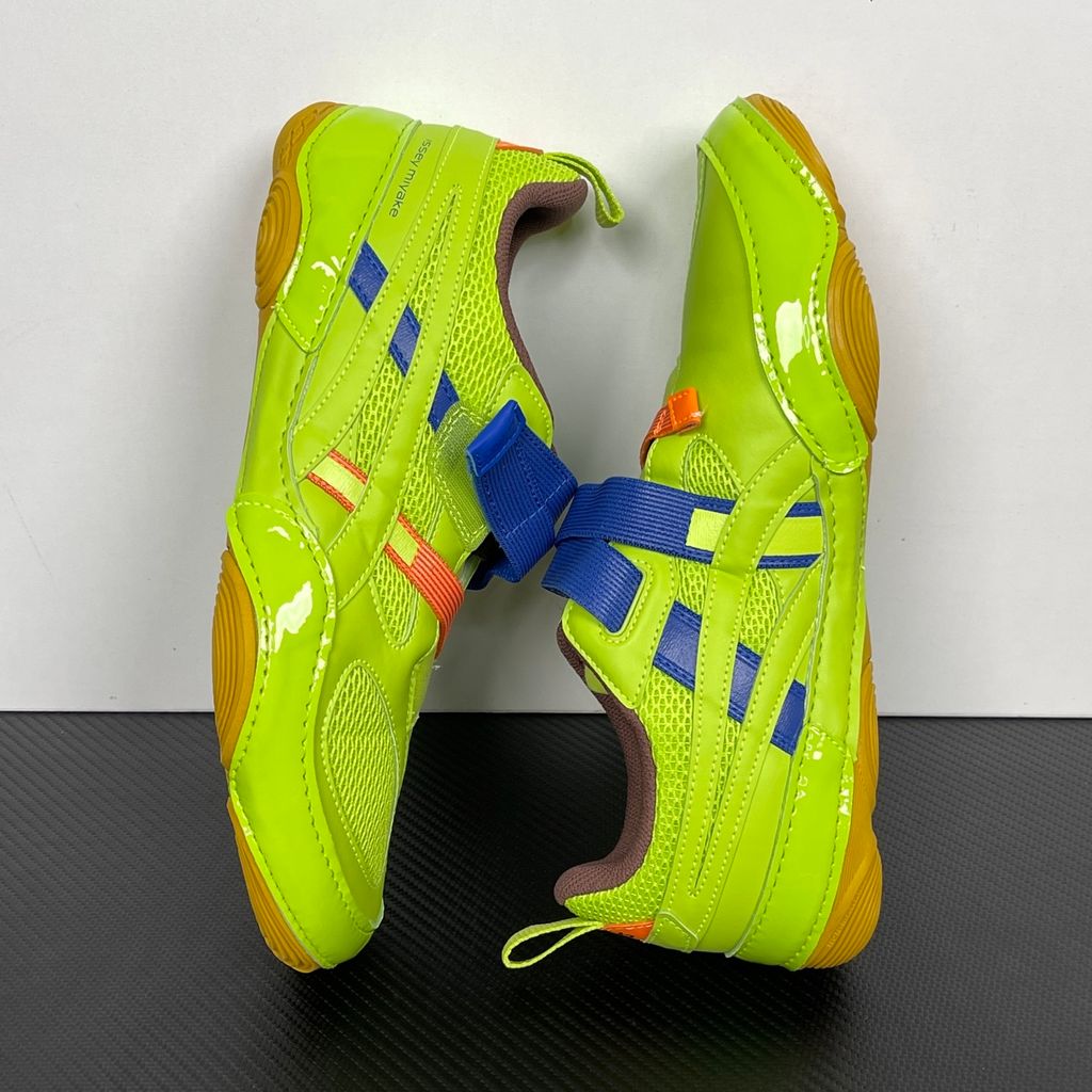 Side profile of the ASICS x Issey Miyake Hyper Taping sneaker in a sophisticated green tonal colorway, highlighting the unique, ribbon-like taping construction, sleek silhouette, and premium collaborative detailing.