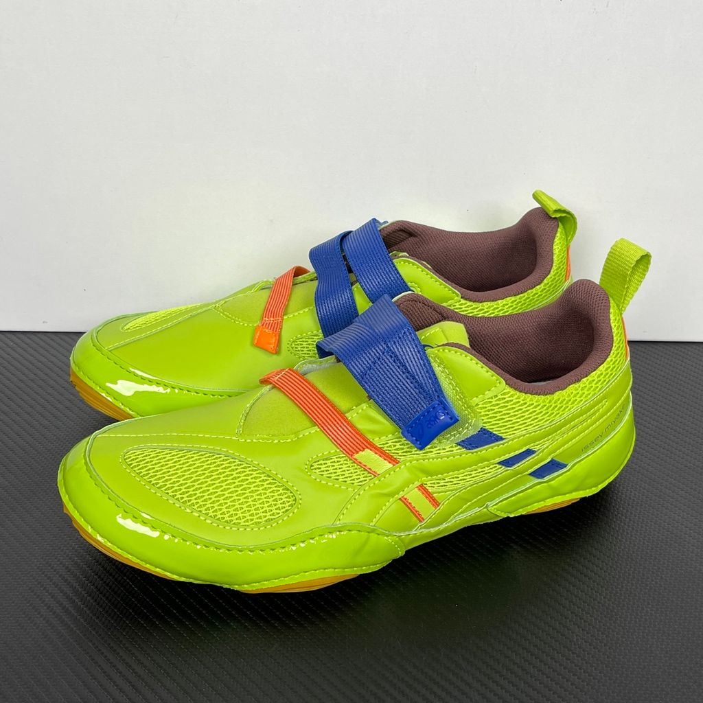 Side profile of the ASICS x Issey Miyake Hyper Taping sneaker in a sophisticated green tonal colorway, highlighting the unique, ribbon-like taping construction, sleek silhouette, and premium collaborative detailing.