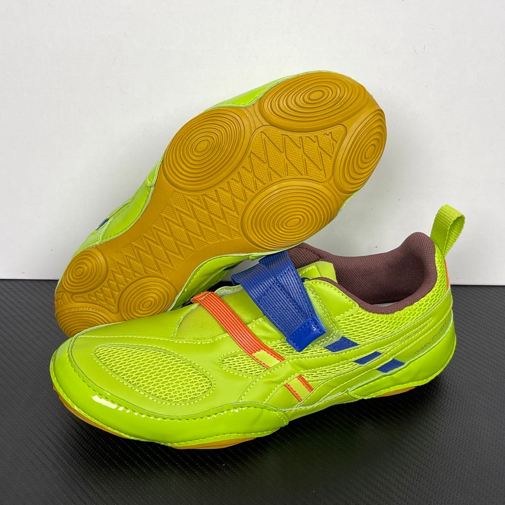 Side profile of the ASICS x Issey Miyake Hyper Taping sneaker in a sophisticated green tonal colorway, highlighting the unique, ribbon-like taping construction, sleek silhouette, and premium collaborative detailing.