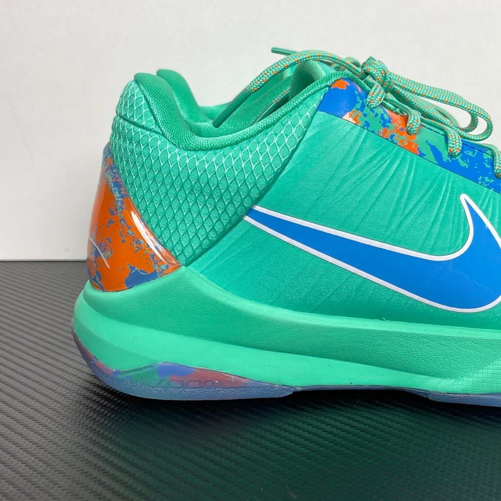 Side profile of the Nike Kobe 5 Protro 'Jalen Brunson NY vs. NY' PE sneaker, highlighting the sharp, low-top performance silhouette, signature Kobe detailing, and the unique color blocking inspired by NYC basketball.