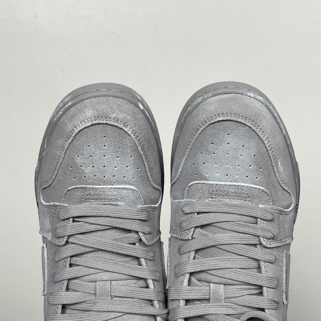 Side profile of the Off-White Out of Office sneaker in a Distressed Dark Grey colorway, highlighting the iconic "FOR WALKING" text printed on the midsole, signature arrow motif, and premium weathered suede construction.