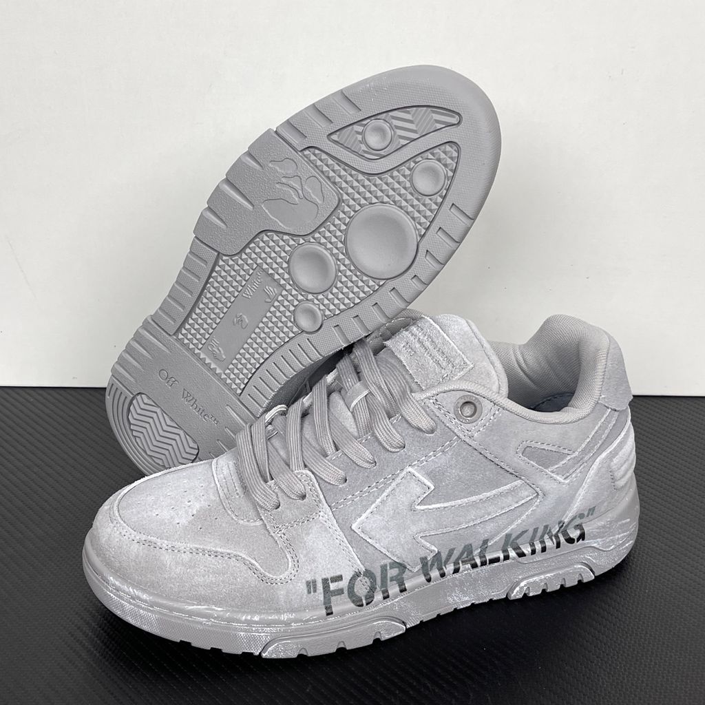 Side profile of the Off-White Out of Office sneaker in a Distressed Dark Grey colorway, highlighting the iconic "FOR WALKING" text printed on the midsole, signature arrow motif, and premium weathered suede construction.