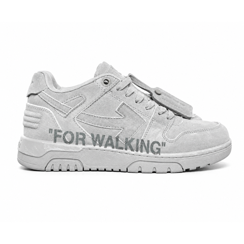 Side profile of the Off-White Out of Office sneaker in a Distressed Dark Grey colorway, highlighting the iconic "FOR WALKING" text printed on the midsole, signature arrow motif, and premium weathered suede construction.
