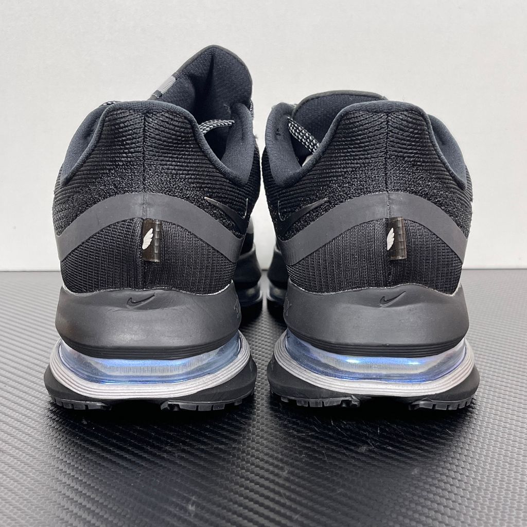 Side profile of the Nike Air Zoom Pegasus Premium sneaker in the 'Black Metallic Silver' colorway, showcasing the lightweight black engineered mesh upper, shimmering metallic silver Swoosh branding, and the sculpted, responsive midsole.
