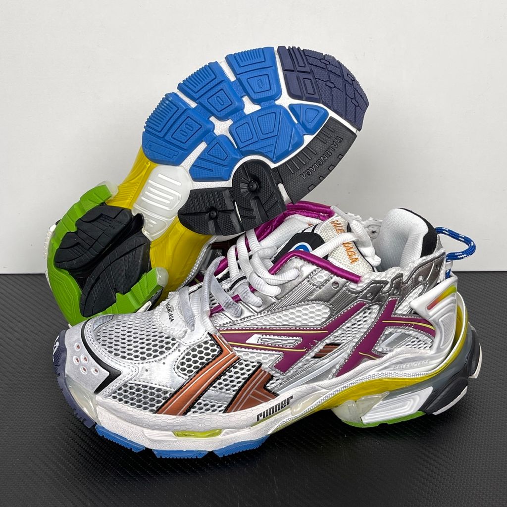 Side profile of the Balenciaga Runner sneaker in the 'Multicolor' colorway, highlighting the intricate multi-layered construction, distressed technical mesh and synthetic overlays, and the iconic dynamic sole unit.