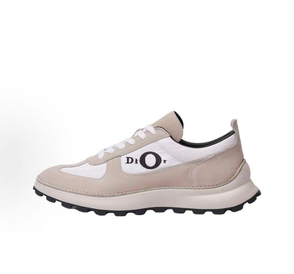 Side profile of the Dior Squash Sneaker, showcasing the white nylon base, beige suede overlays, prominent black "DiOr" side logo, and chunky white midsole with a black lugged outsole.