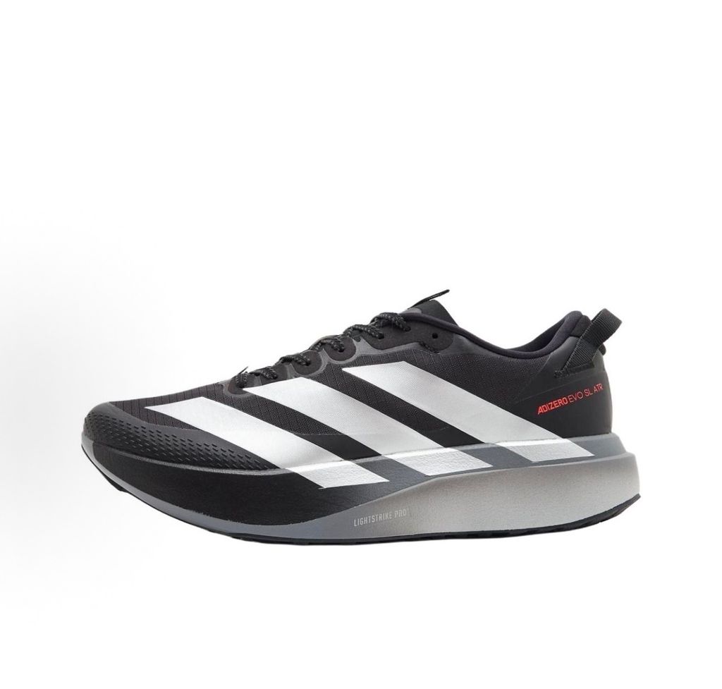 Side profile of the adidas Adizero Evo SL running shoe in the 'ATROnix Grey Black' colorway, showcasing the ultra-lightweight breathable mesh upper, sleek aerodynamic profile, and the sculpted Lightstrike Pro foam midsole.