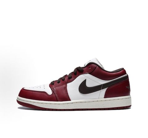 Side profile of the Air Jordan 1 Low SE sneaker in the 'Sail Baroque Brown Team Red' colorway, showcasing the smooth sail leather base, rich baroque brown overlays, and striking team red Swoosh.