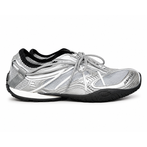Side profile of the Balenciaga Radar Sneaker featuring a metallic silver and grey mesh upper, intricate gradient line overlays, a classic lace-up system, and a sleek, low-profile black rubber outsole.