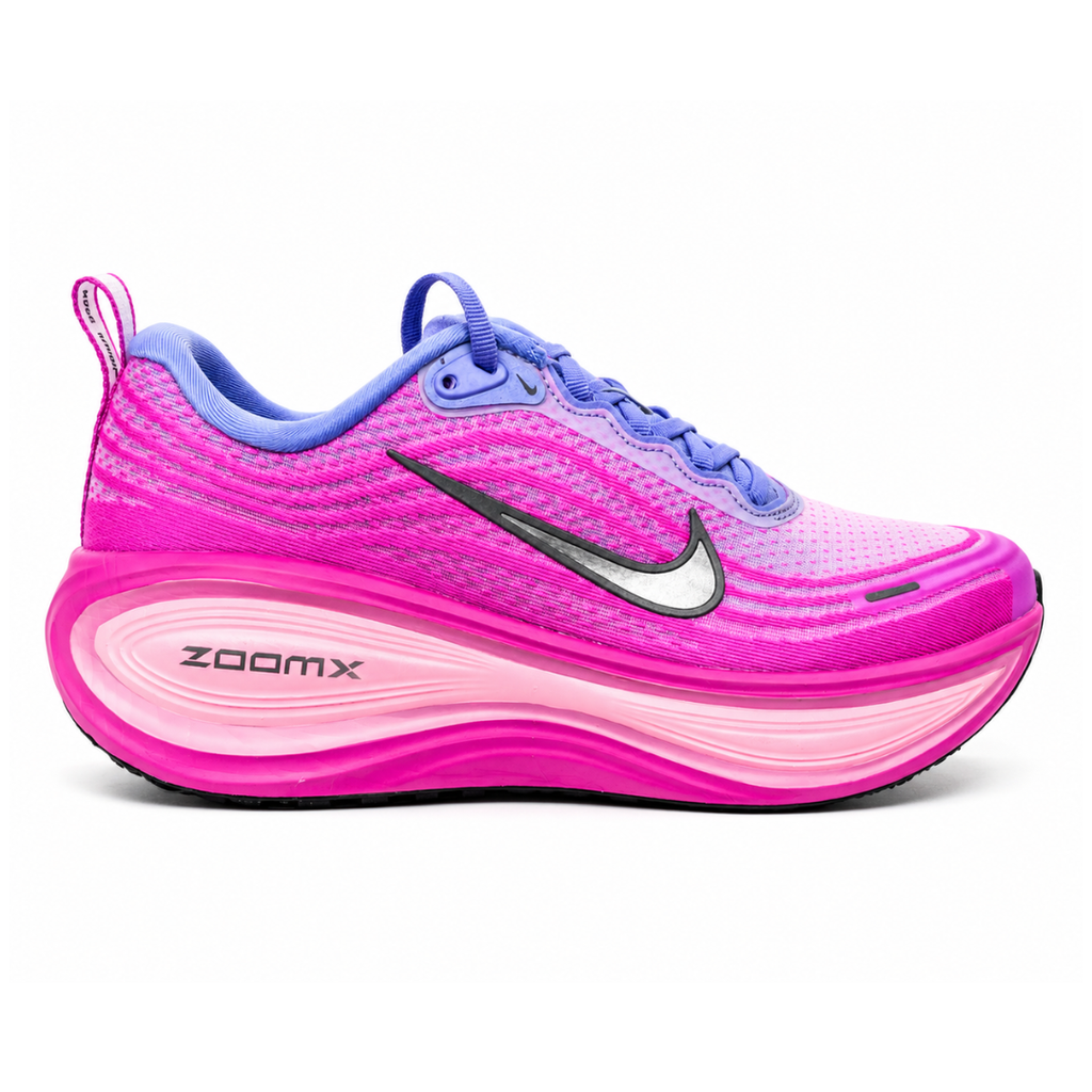 Side profile of the Nike Women's Vomero Plus running shoe, featuring a vibrant pink and purple engineered mesh upper, a metallic dark grey Swoosh, and a heavily cushioned, sculpted pink ZoomX foam midsole.