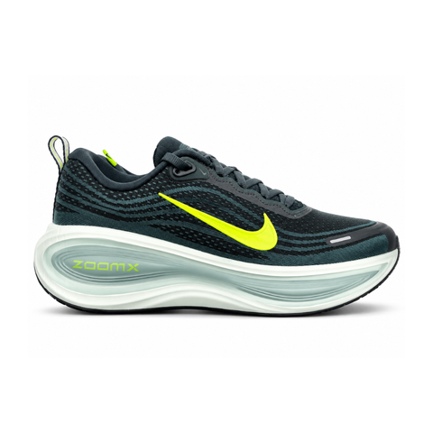 Side profile of the Nike Vomero Plus running shoe, featuring an earthy green engineered mesh upper with Seaweed and Cannon overlays, striking neon Volt accents, and a heavily cushioned, sculpted ZoomX foam midsole.