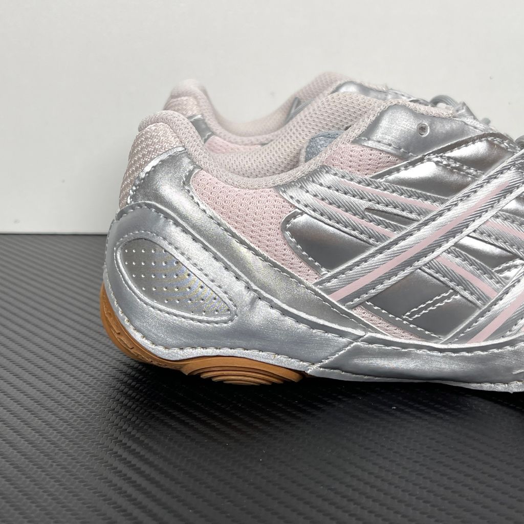 Side profile of the ASICS Hypersync sneaker in the Piedmont Grey and Pink Cloud colorway, showcasing the breathable technical mesh upper, metallic synthetic overlays, soft pink accents, and the sculpted performance midsole.