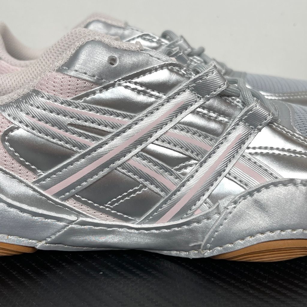 Side profile of the ASICS Hypersync sneaker in the Piedmont Grey and Pink Cloud colorway, showcasing the breathable technical mesh upper, metallic synthetic overlays, soft pink accents, and the sculpted performance midsole.