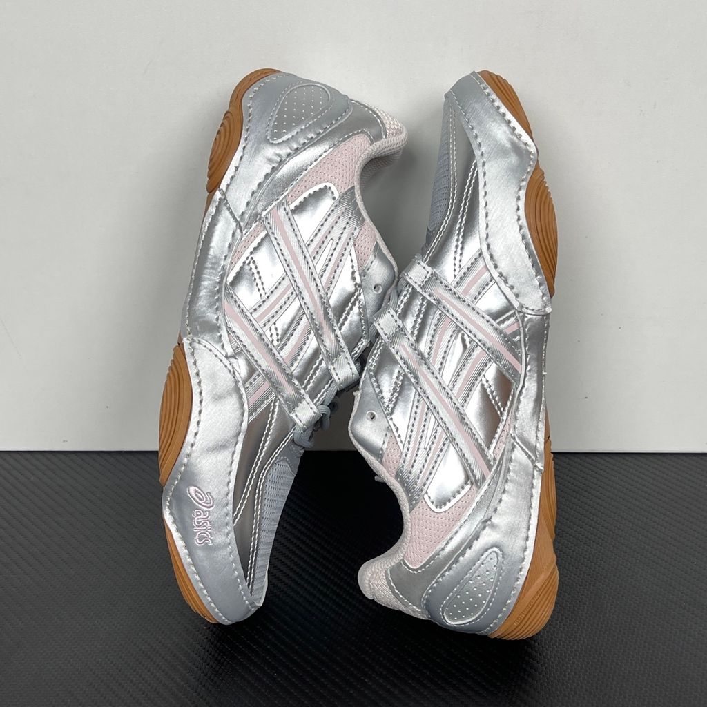 Side profile of the ASICS Hypersync sneaker in the Piedmont Grey and Pink Cloud colorway, showcasing the breathable technical mesh upper, metallic synthetic overlays, soft pink accents, and the sculpted performance midsole.