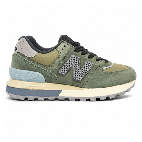 Side profile of the New Balance 574 Legacy Stone Island sneaker featuring a tactical dark green ripstop and suede upper, the iconic Stone Island compass logo on the tongue, and a rugged grey ENCAP midsole.