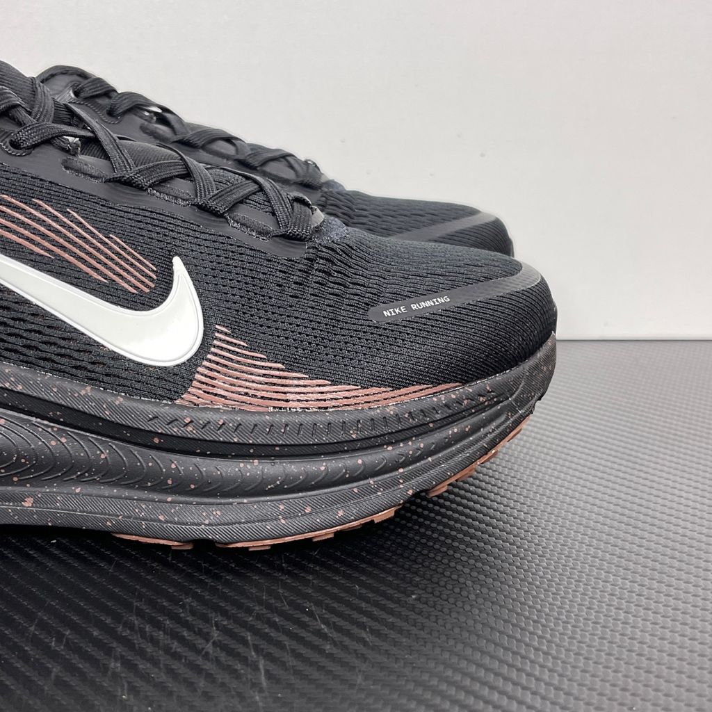 Side profile of the Nike Vomero 18 running shoe featuring a rich, tonal 'Coffee Bean' brown engineered mesh upper, subtle tonal Nike Swoosh branding, and a heavily cushioned, sculpted foam midsole.