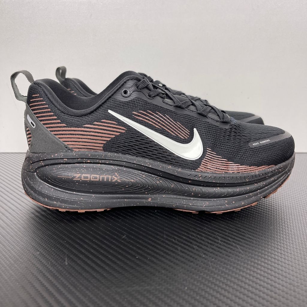 Side profile of the Nike Vomero 18 running shoe featuring a rich, tonal 'Coffee Bean' brown engineered mesh upper, subtle tonal Nike Swoosh branding, and a heavily cushioned, sculpted foam midsole.