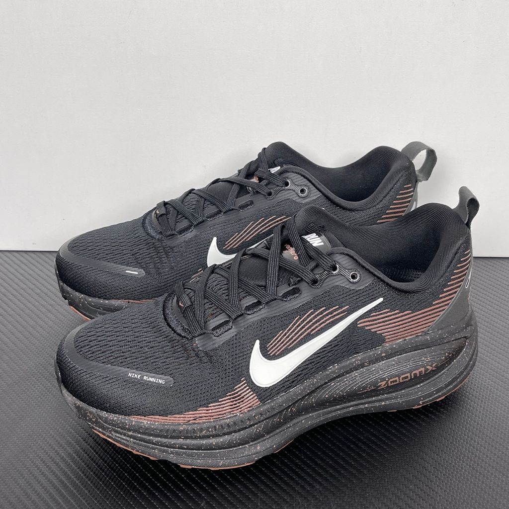 Side profile of the Nike Vomero 18 running shoe featuring a rich, tonal 'Coffee Bean' brown engineered mesh upper, subtle tonal Nike Swoosh branding, and a heavily cushioned, sculpted foam midsole.