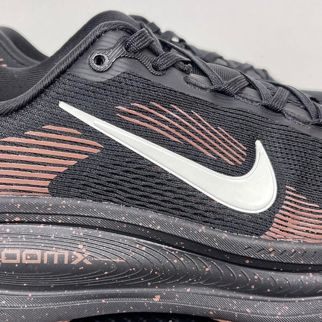 Side profile of the Nike Vomero 18 running shoe featuring a rich, tonal 'Coffee Bean' brown engineered mesh upper, subtle tonal Nike Swoosh branding, and a heavily cushioned, sculpted foam midsole.
