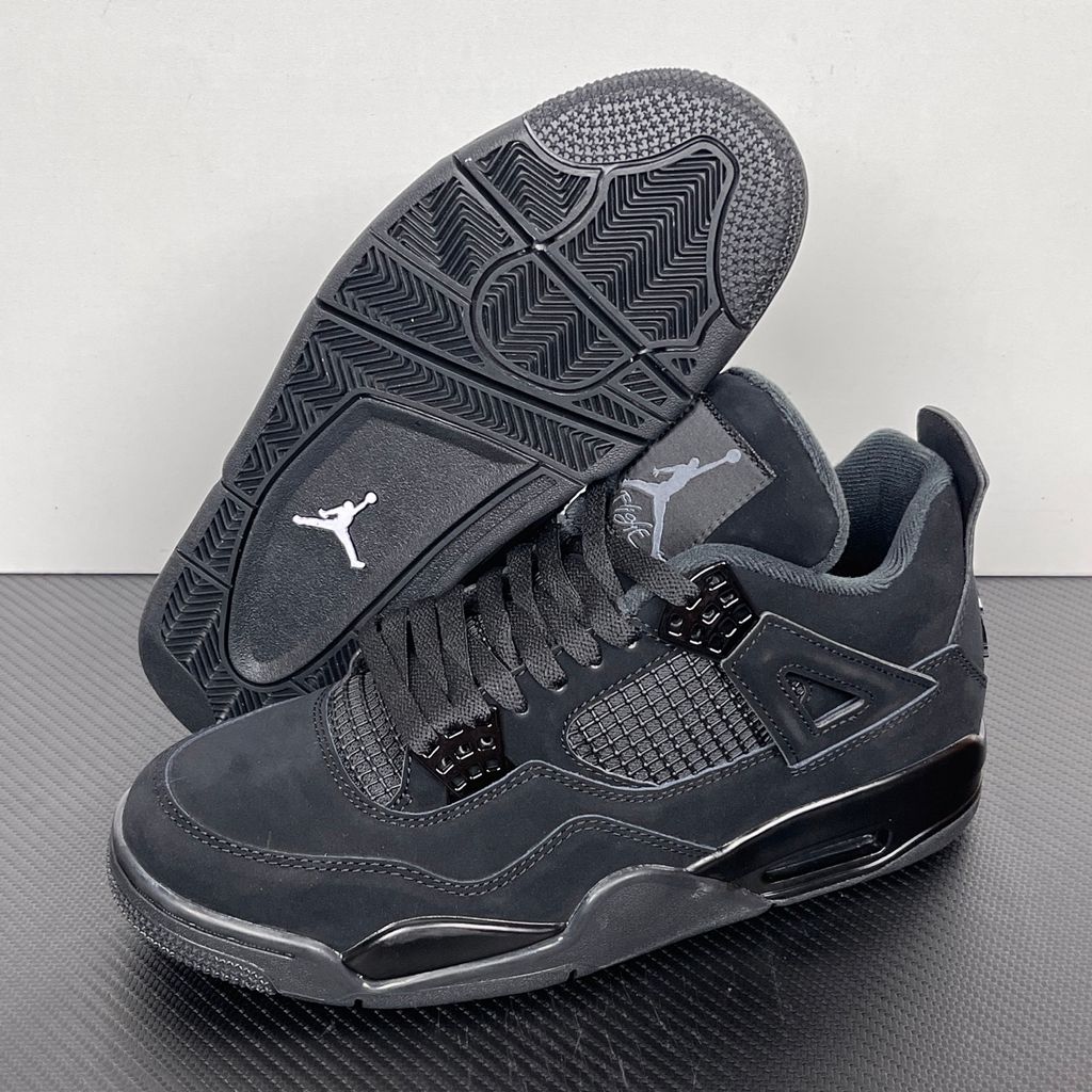 Side profile of the Air Jordan 4 Retro 'Black Cat' (2020) featuring a stealthy, monochromatic all-black nubuck suede upper, matching black mesh netting, matte wing eyelets, and a black midsole with a visible Air unit.  Product Description