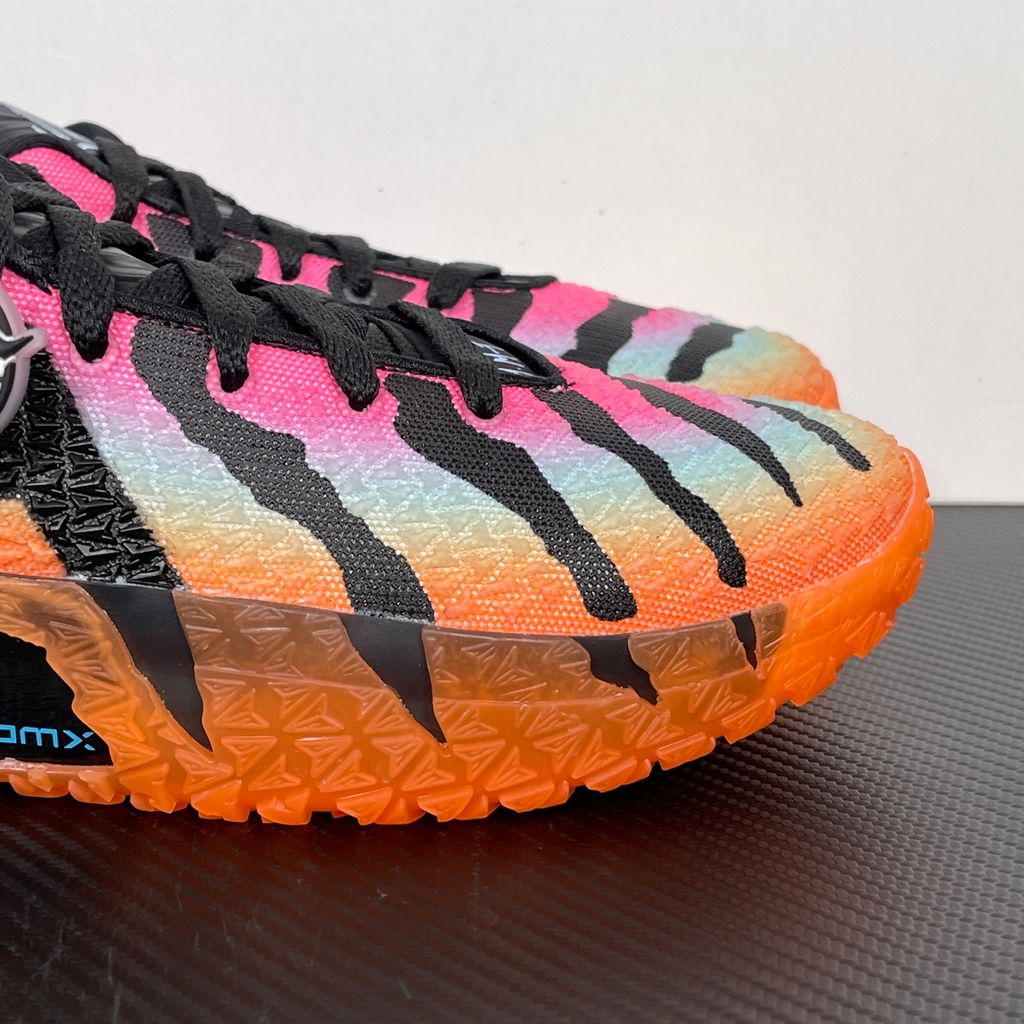 Side profile of the Nike Ja 3 'At Dawn' basketball sneaker, featuring a sleek, lightweight dark mesh upper contrasted by vibrant sunrise-inspired gradient accents, resting on a supportive midsole equipped with Zoom Air cushioning.