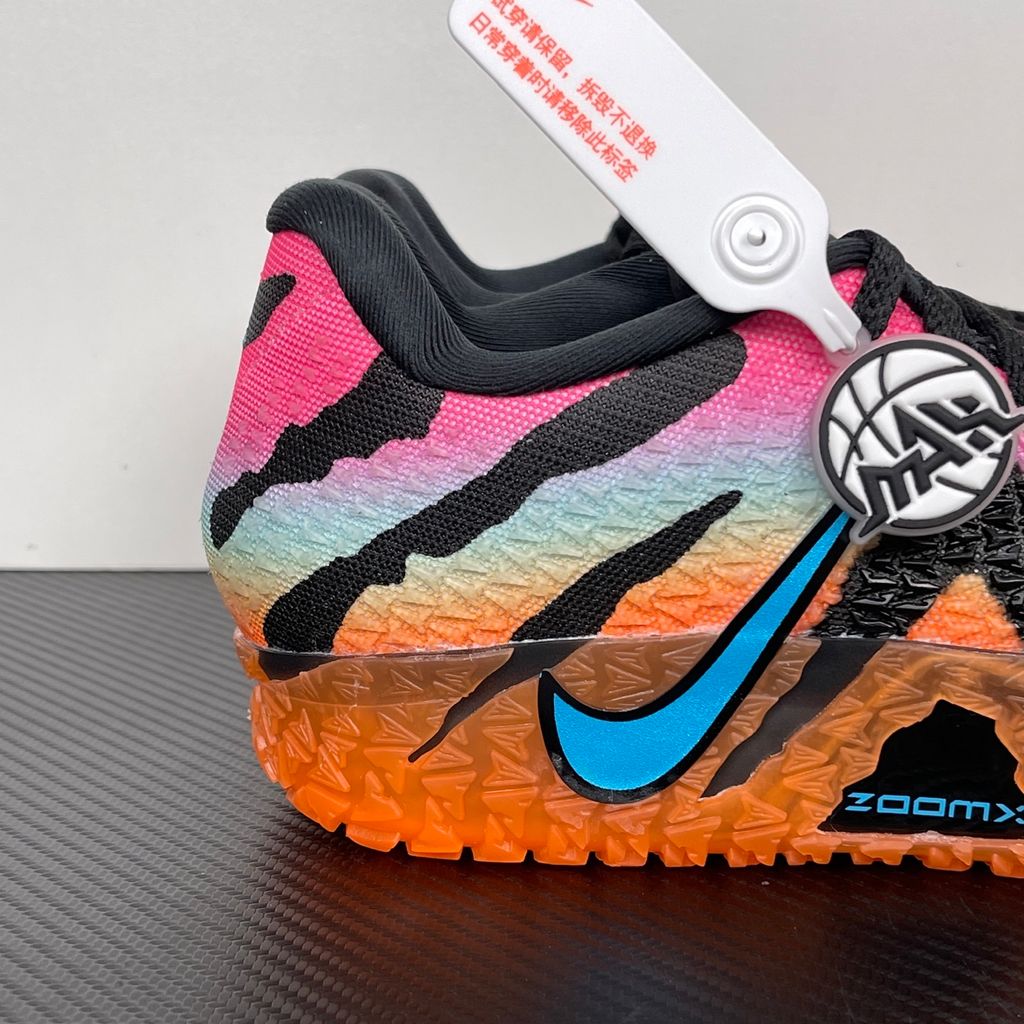 Side profile of the Nike Ja 3 'At Dawn' basketball sneaker, featuring a sleek, lightweight dark mesh upper contrasted by vibrant sunrise-inspired gradient accents, resting on a supportive midsole equipped with Zoom Air cushioning.
