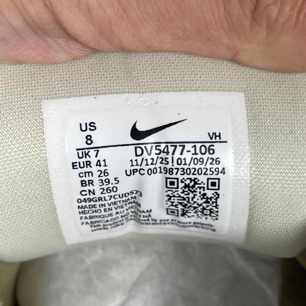Side profile of the Nike SB Force 58 skate shoe featuring a creamy Coconut Milk canvas and suede upper, accented by a Neutral Olive green Swoosh and detailing, resting on a crisp white sole with a flexible tri-star tread.