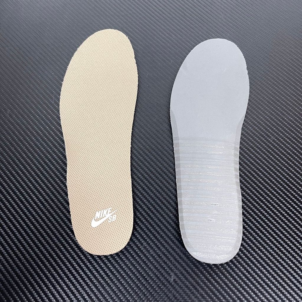 Side profile of the Nike SB Force 58 skate shoe featuring a creamy Coconut Milk canvas and suede upper, accented by a Neutral Olive green Swoosh and detailing, resting on a crisp white sole with a flexible tri-star tread.