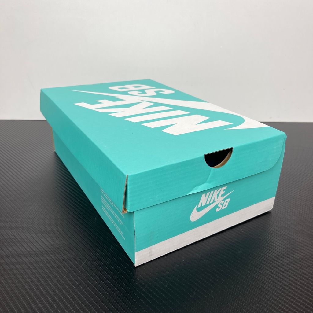 Side profile of the Nike SB Force 58 skate shoe featuring a vibrant Dutch Blue canvas and suede upper, accented by a crisp white Swoosh and detailing, resting on a white sole with a flexible tri-star tread.