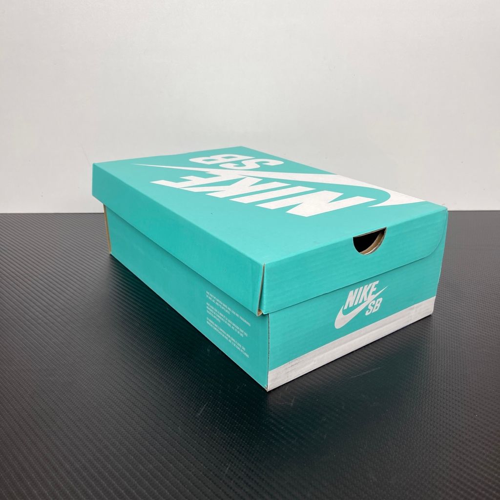 Side profile of the Nike SB Force 58 skate shoe featuring a soft Light Armory Blue canvas and suede upper, accented by a deep Thunder Blue Swoosh and detailing, resting on a crisp white sole with a flexible tri-star tread.