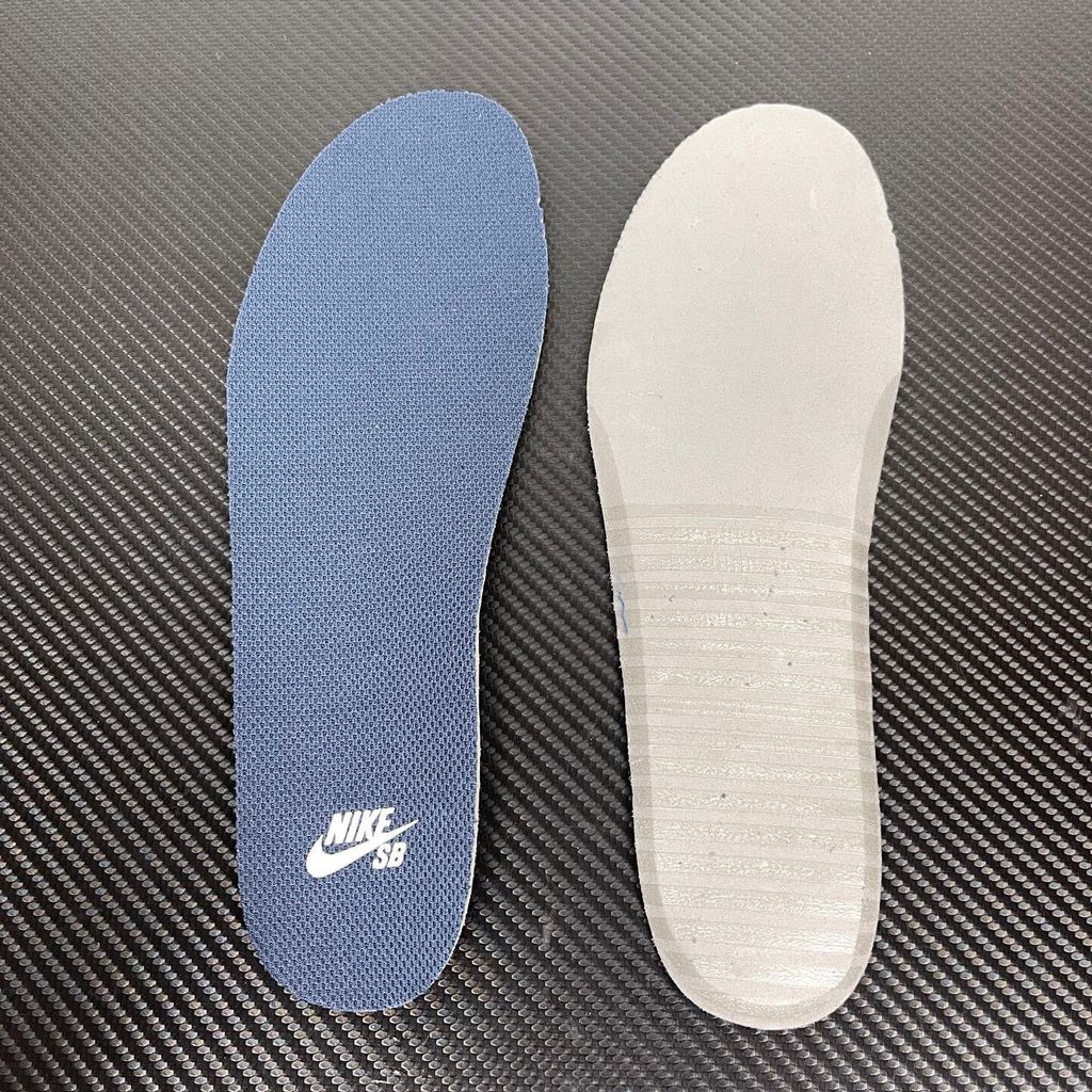 Side profile of the Nike SB Force 58 skate shoe featuring a soft Light Armory Blue canvas and suede upper, accented by a deep Thunder Blue Swoosh and detailing, resting on a crisp white sole with a flexible tri-star tread.