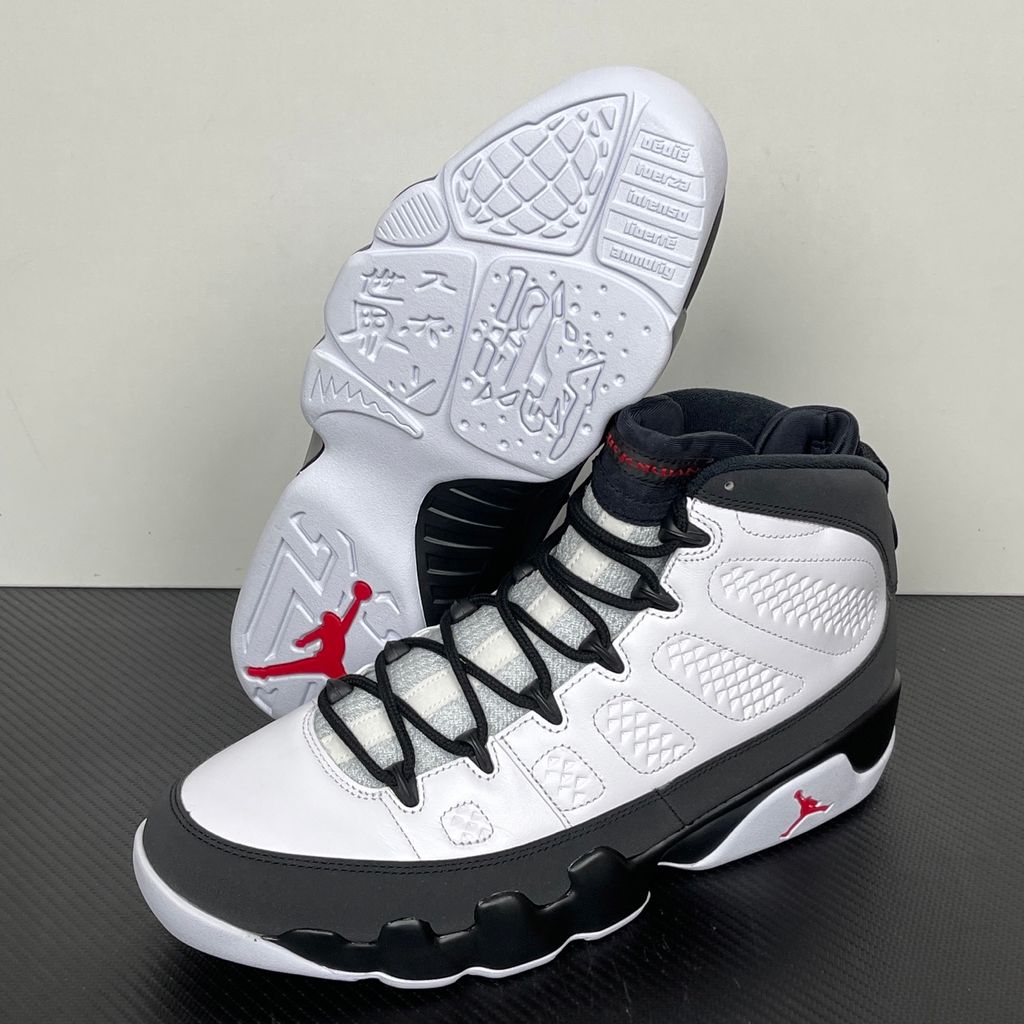 Side profile of the Air Jordan 9 Retro OG 'Space Jam' (2026) sneaker featuring a crisp white leather upper, a sleek black mudguard and midsole, True Red branding on the heel, and a classic sculpted rubber outsole.