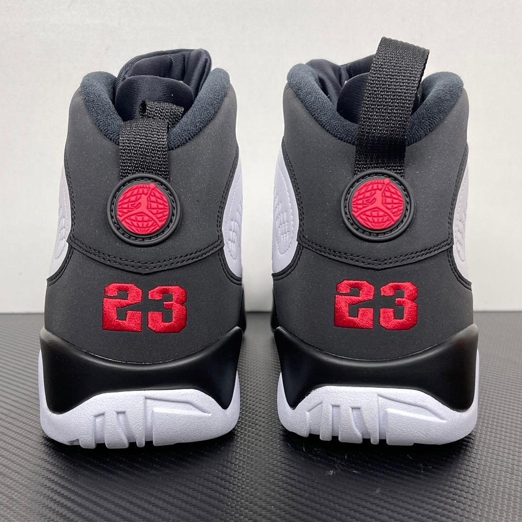 Side profile of the Air Jordan 9 Retro OG 'Space Jam' (2026) sneaker featuring a crisp white leather upper, a sleek black mudguard and midsole, True Red branding on the heel, and a classic sculpted rubber outsole.