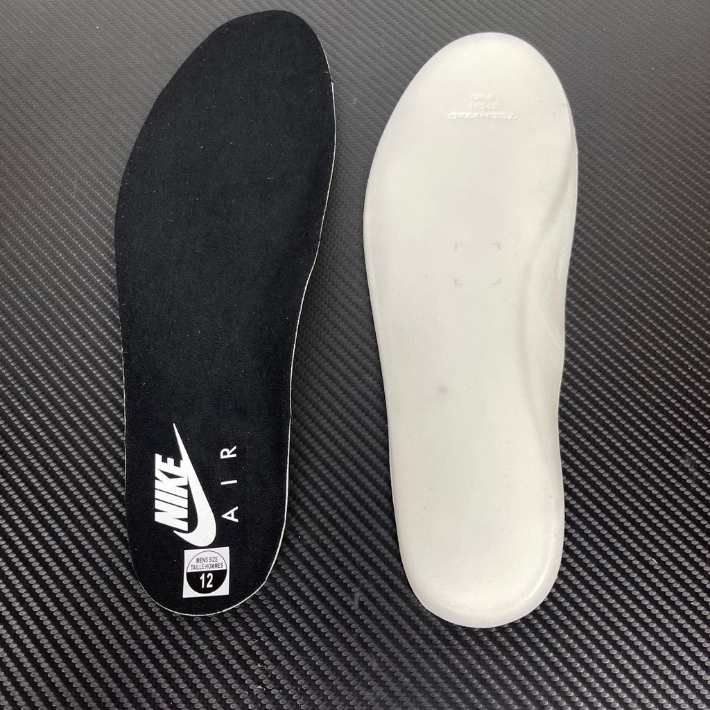 Side profile of the Air Jordan 9 Retro OG 'Space Jam' (2026) sneaker featuring a crisp white leather upper, a sleek black mudguard and midsole, True Red branding on the heel, and a classic sculpted rubber outsole.