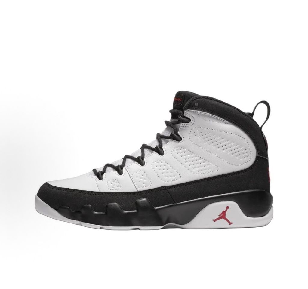 Side profile of the Air Jordan 9 Retro OG 'Space Jam' (2026) sneaker featuring a crisp white leather upper, a sleek black mudguard and midsole, True Red branding on the heel, and a classic sculpted rubber outsole.