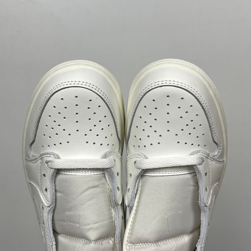 Side profile of the Air Jordan 9 Retro OG 'Space Jam' (2026) sneaker featuring a crisp white leather upper, a sleek black mudguard and midsole, True Red branding on the heel, and a classic sculpted rubber outsole.