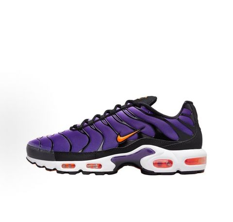 Side profile of the Nike Air Max Plus OG sneaker featuring a vibrant Voltage Purple gradient mesh upper, signature black wavy TPU overlays, striking Total Orange accents on the Swoosh and visible Air units, resting on a crisp white midsole.