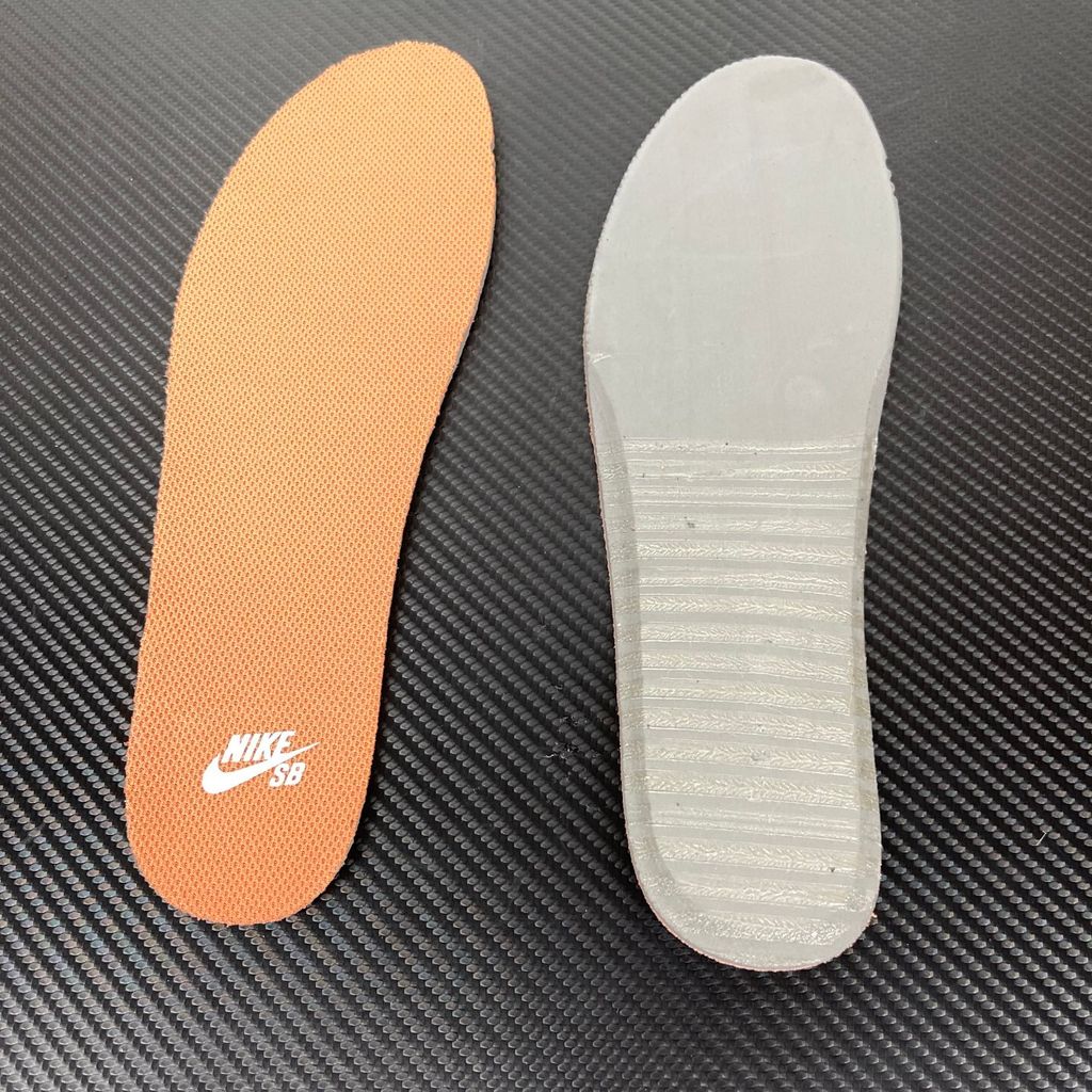 Side profile of the Nike SB Force 58 skate shoe featuring a sleek Black suede and Cool Gray canvas upper, accented by a crisp Mountain Peak White Swoosh and detailing, resting on a white sole with a flexible tri-star tread.