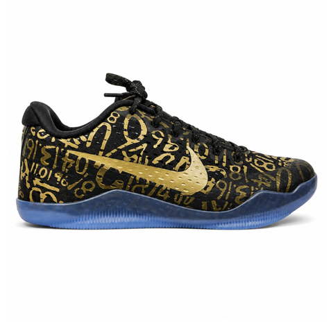 Side profile of the Nike Kobe 11 Protro basketball shoe in the Mamba Day colorway, featuring a sleek black upper with striking metallic gold Swoosh detailing, signature Kobe branding, and a translucent rubber outsole.