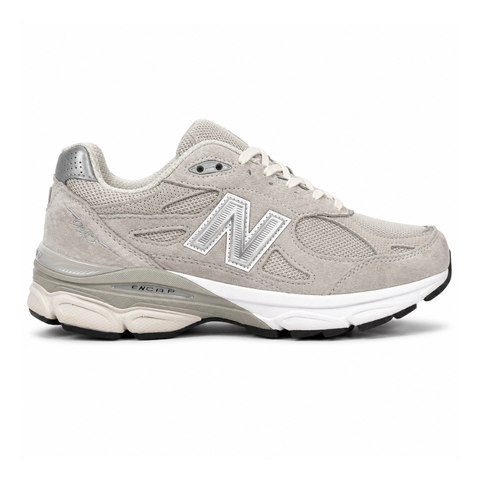 Side profile of the collaborative New Balance 990v3 MiUSA sneaker in the exclusive Kith Hallow colorway, featuring a premium tonal pigskin suede and mesh upper, a silver reflective 'N' logo, and a split ENCAP midsole.