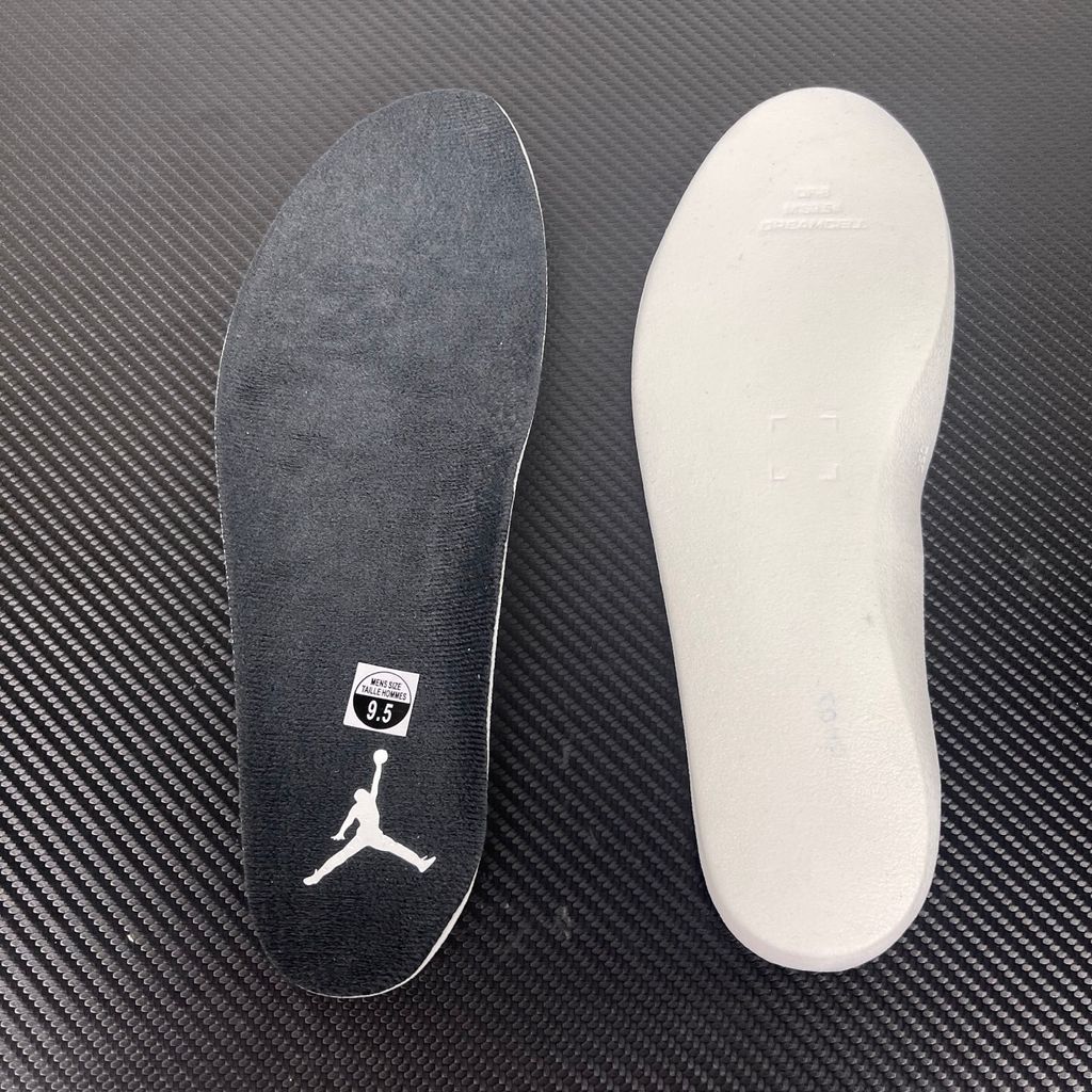 Side profile of the Air Jordan 6 Retro 'Oreo' (2026) sneaker featuring a crisp white leather upper, contrasting black nubuck underlays, signature speckled midsole detailing, an iconic lace toggle, and an icy translucent rubber outsole.