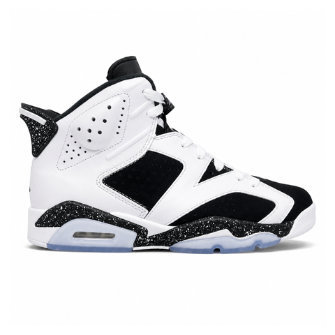 Side profile of the Air Jordan 6 Retro 'Oreo' (2026) sneaker featuring a crisp white leather upper, contrasting black nubuck underlays, signature speckled midsole detailing, an iconic lace toggle, and an icy translucent rubber outsole.