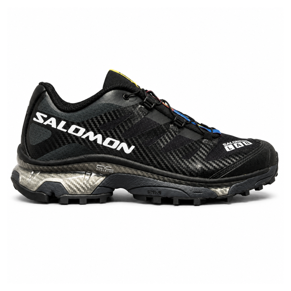 Side profile of the Salomon XT-4 OG trail running sneaker in a sleek all-black colorway, featuring a durable TPU film mesh upper, a Quicklace system, and an aggressive Contagrip rubber outsole.