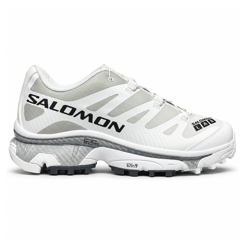 Side profile of the Salomon XT-4 OG trail running sneaker in a clean White and Lunar Rock colorway, featuring a durable TPU film mesh upper, a Quicklace system, and an aggressive Contagrip rubber outsole.