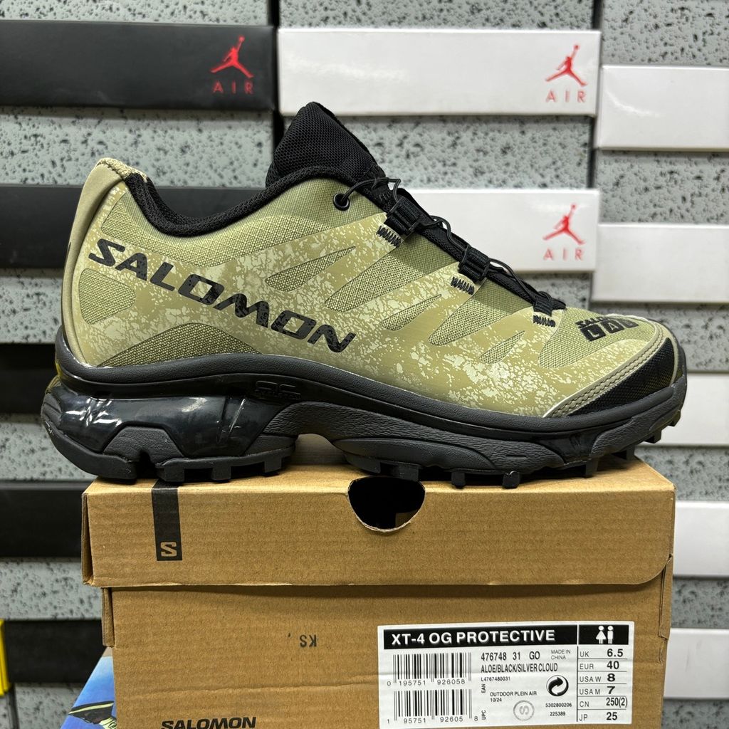 Side profile of the Salomon XT-4 OG trail running sneaker in an earthy Protective Aloe green and Black colorway, featuring a durable TPU film mesh upper, a Quicklace system, and an aggressive Contagrip rubber outsole.