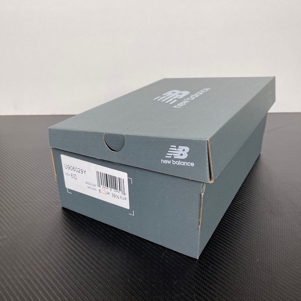 Side profile of the New Balance 9060 sneaker featuring a breathable Sea Salt mesh upper, premium Timberwolf suede overlays, a classic 'N' logo, and a dramatic, chunky wavy midsole with ABZORB cushioning.